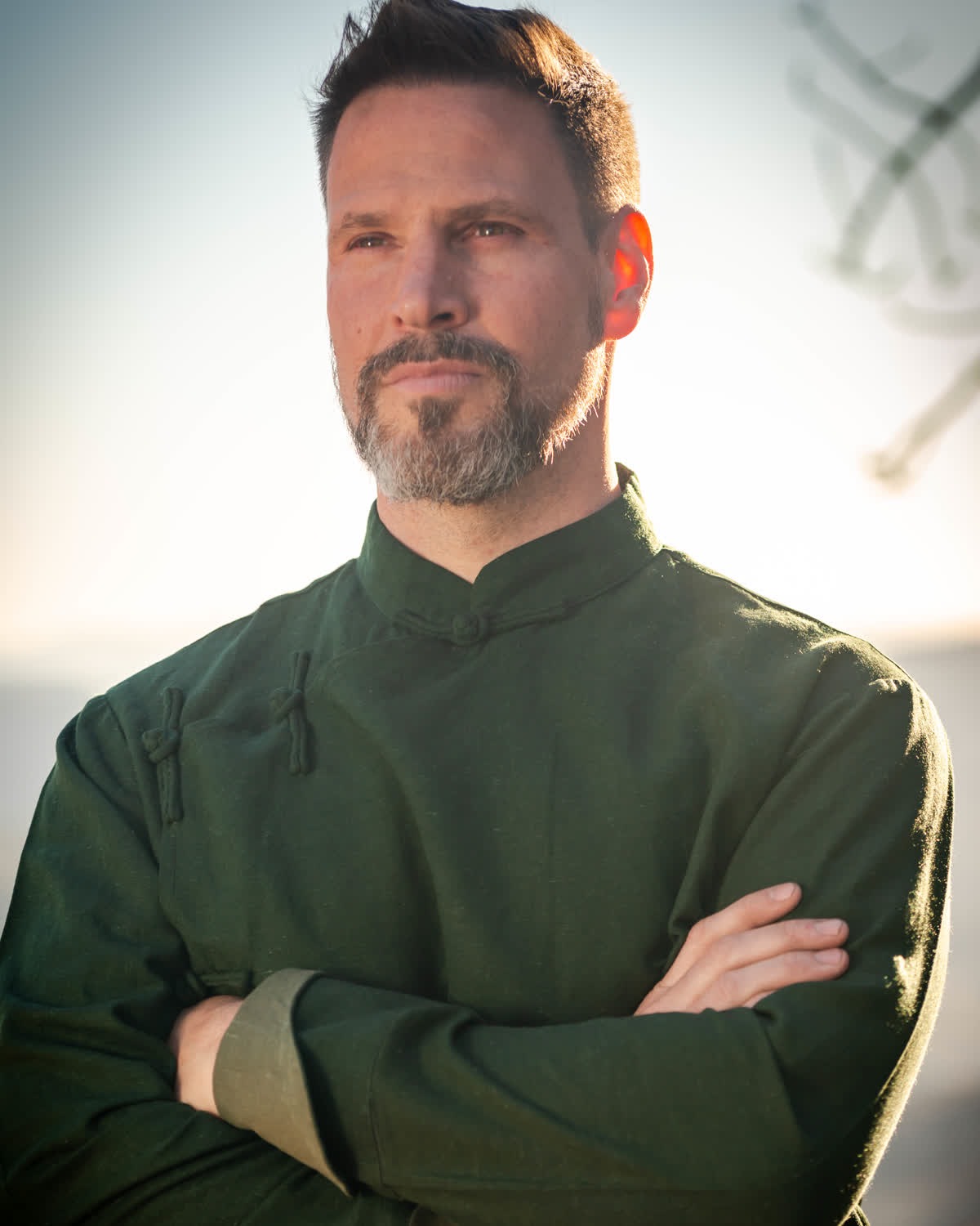 Portrait of Kai Van Bodhi on a mountain ridge at golden hour
